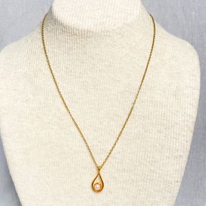 Pendant Necklace Pearlesque Bead On A Gold Tone Teardrop Rim With Cable Chain